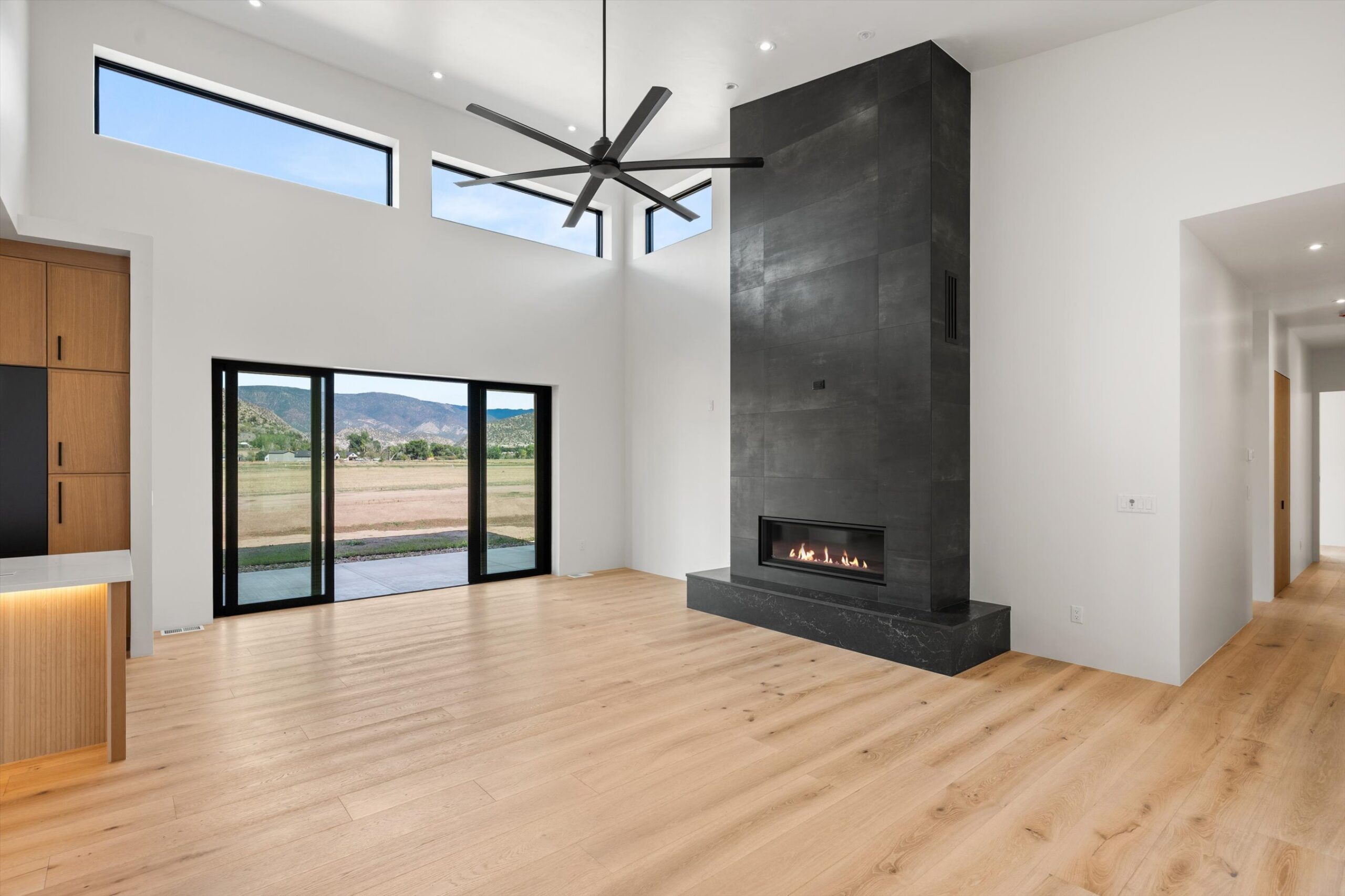 Great room seating area with linear fireplace