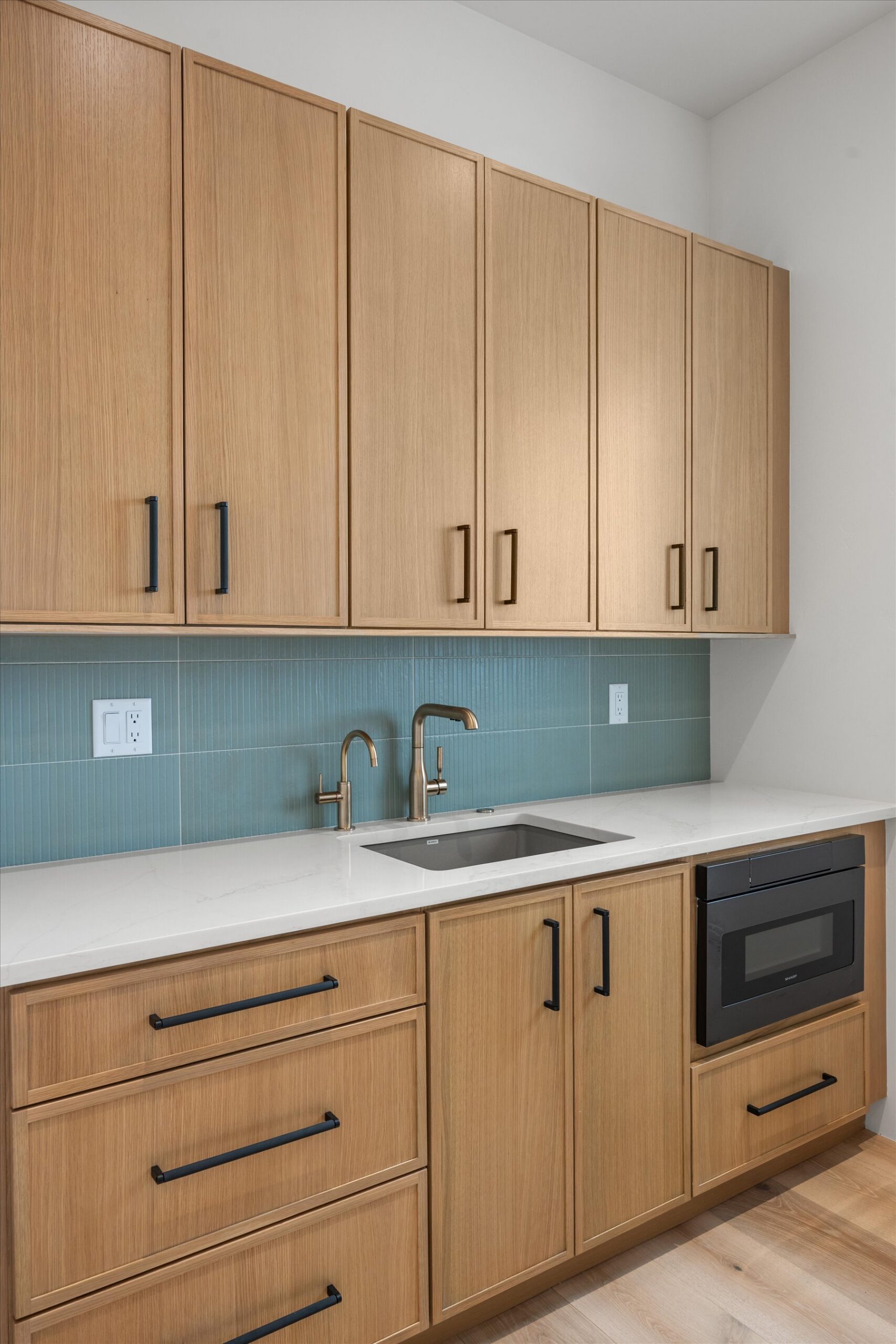 Butler's pantry with blue tile backsplash