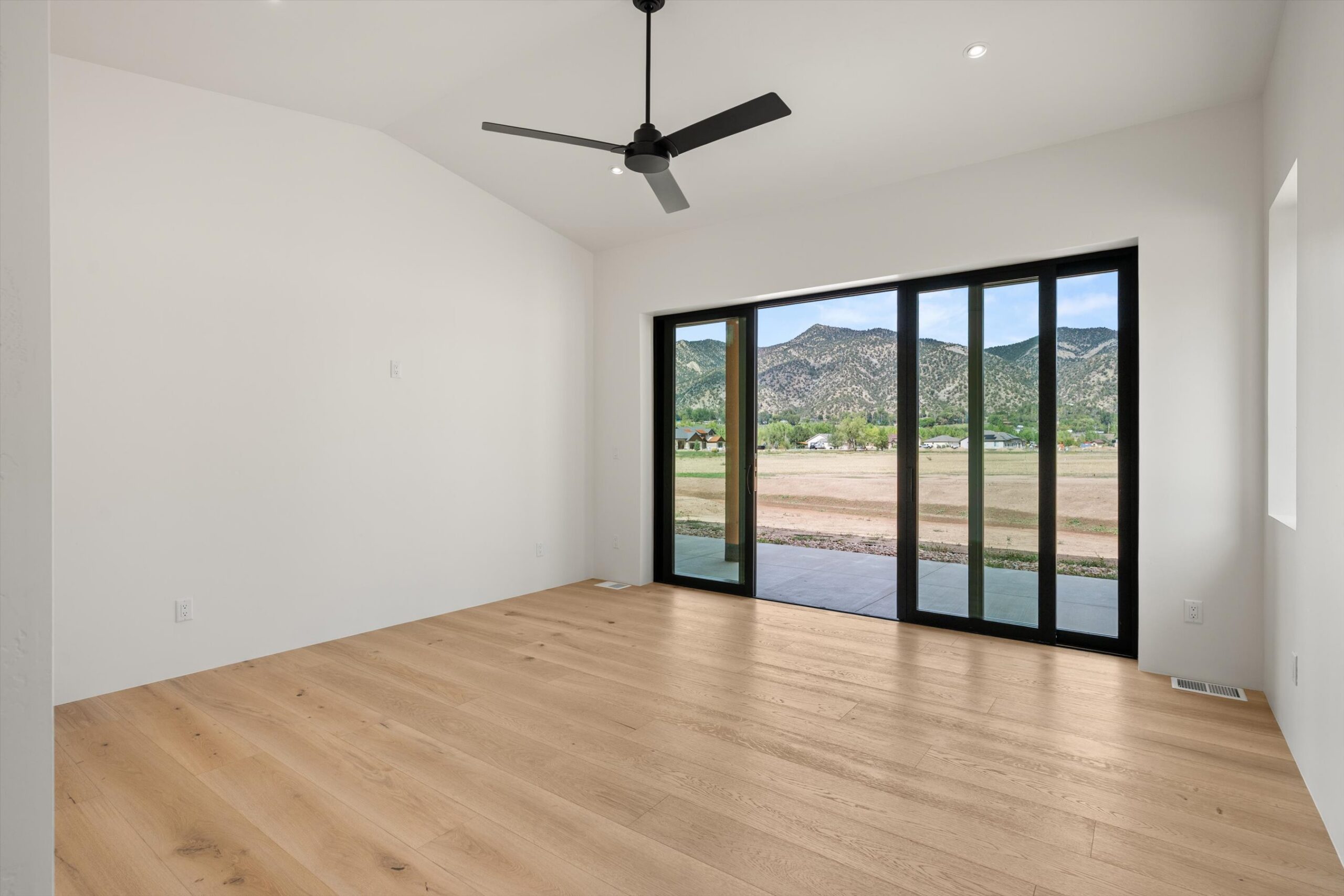 Primary bedroom with sliding doors to patio