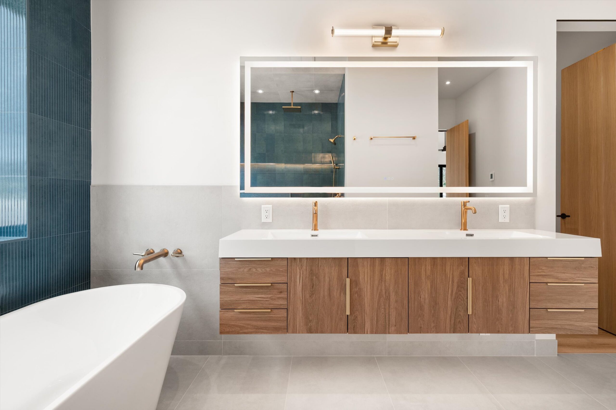 Primary bath double vanity with shower reflection