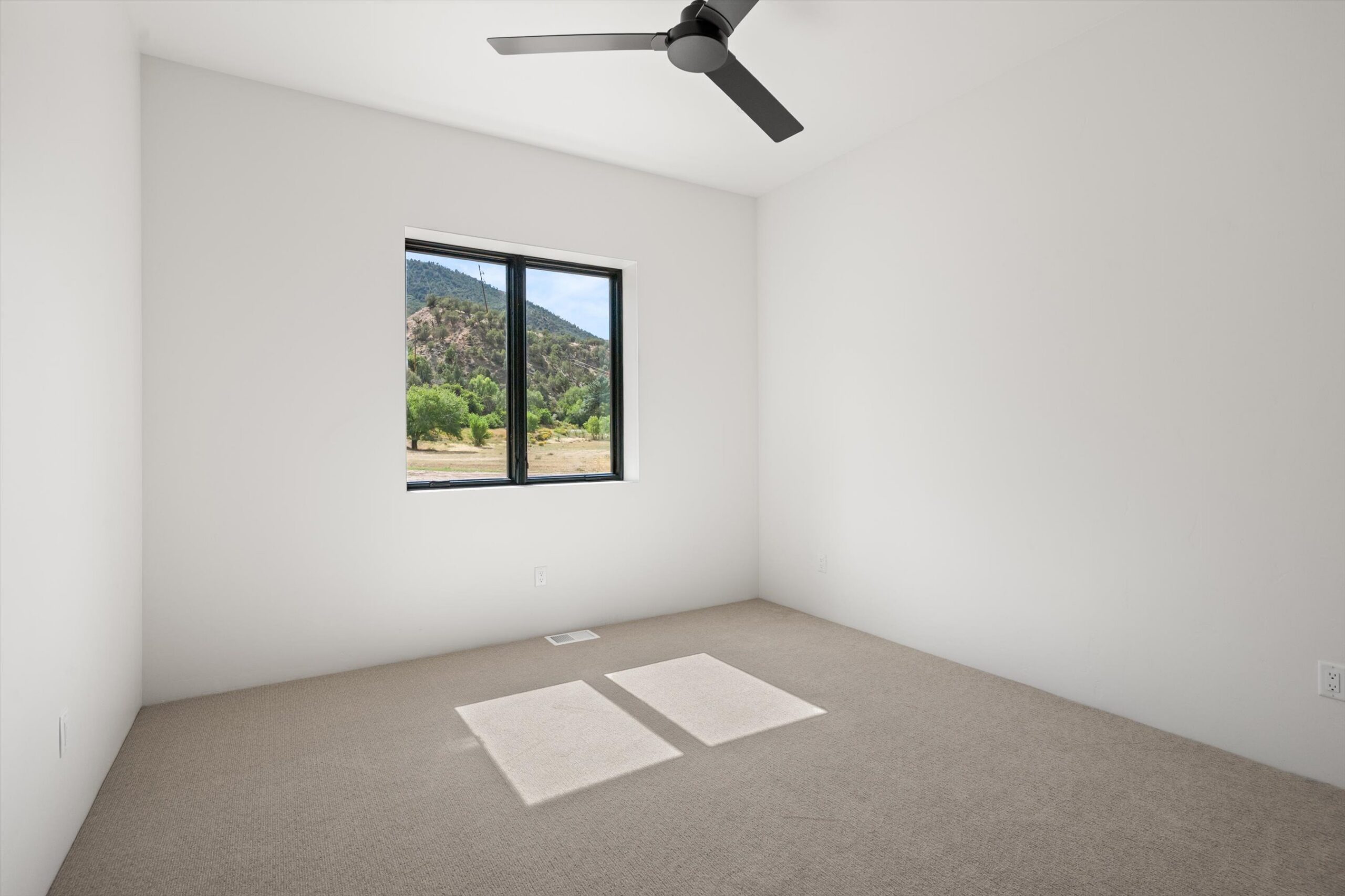Secondary bedroom with mountain-view window