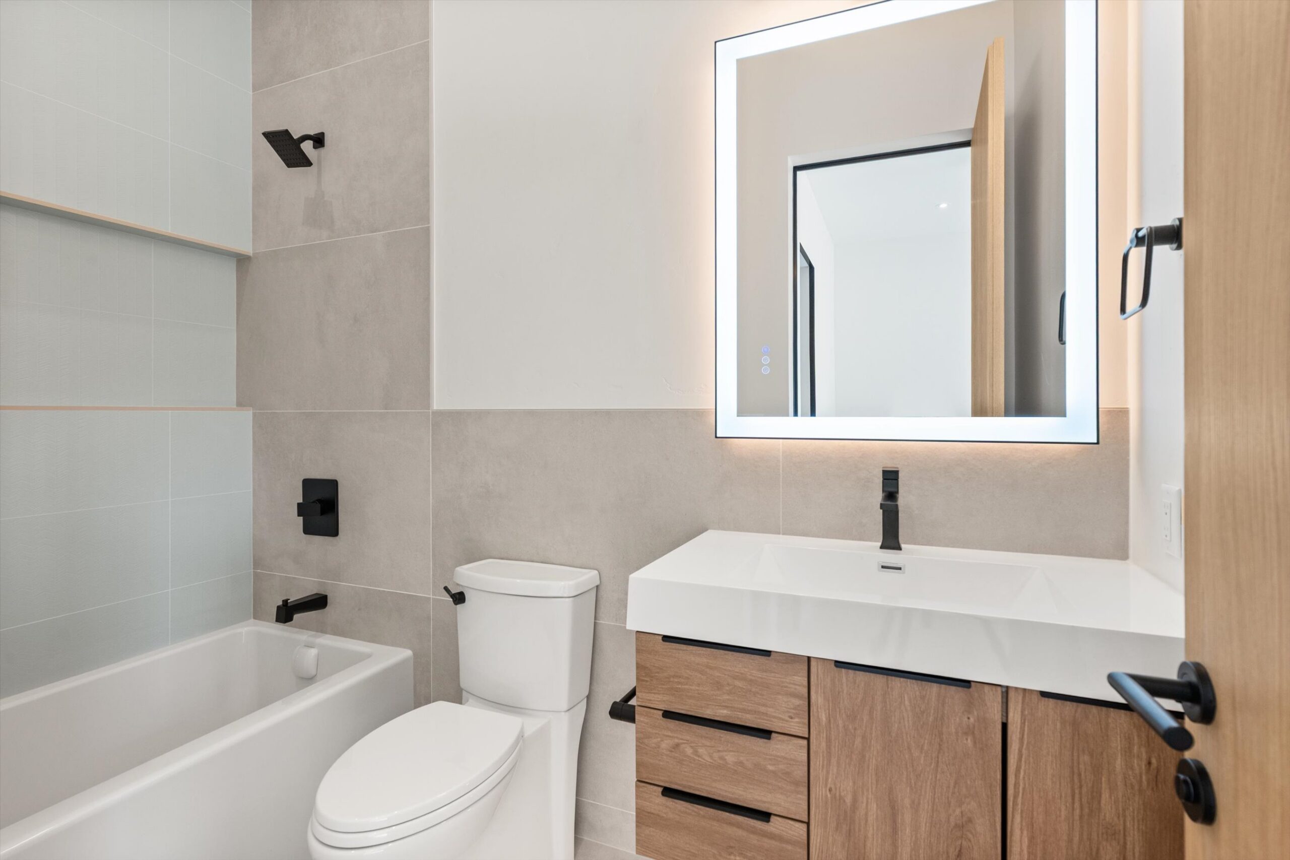 Secondary bath with soaking tub and vanity