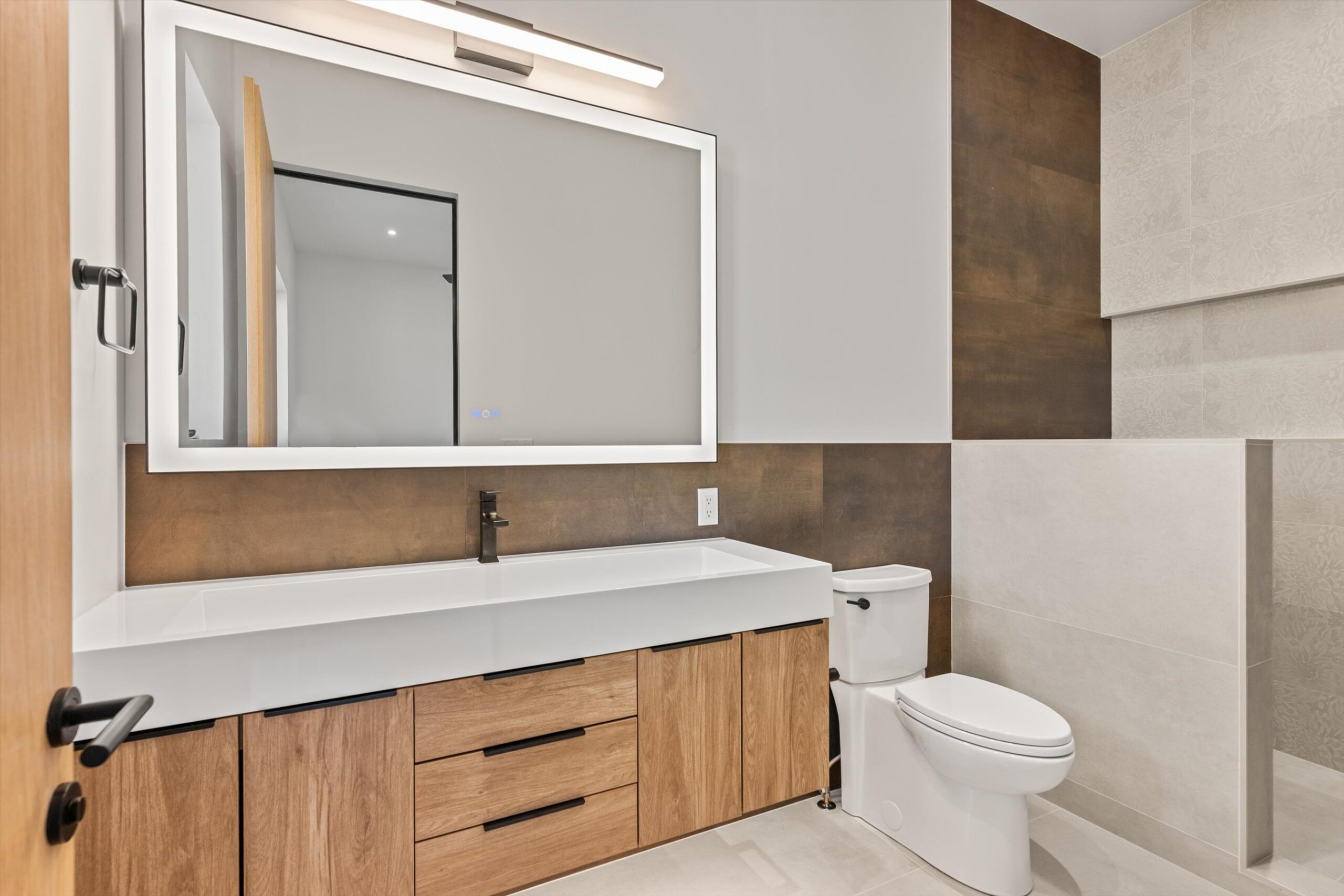 Secondary bath vanity beside walk-in shower